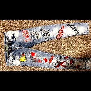 Blue denim skinny jeans (w/ graphics on pants)